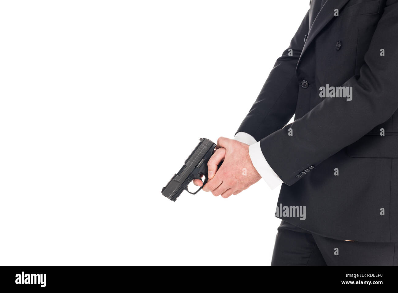 Vue partielle de tueur dans black Jacket holding gun, isolated on white Banque D'Images