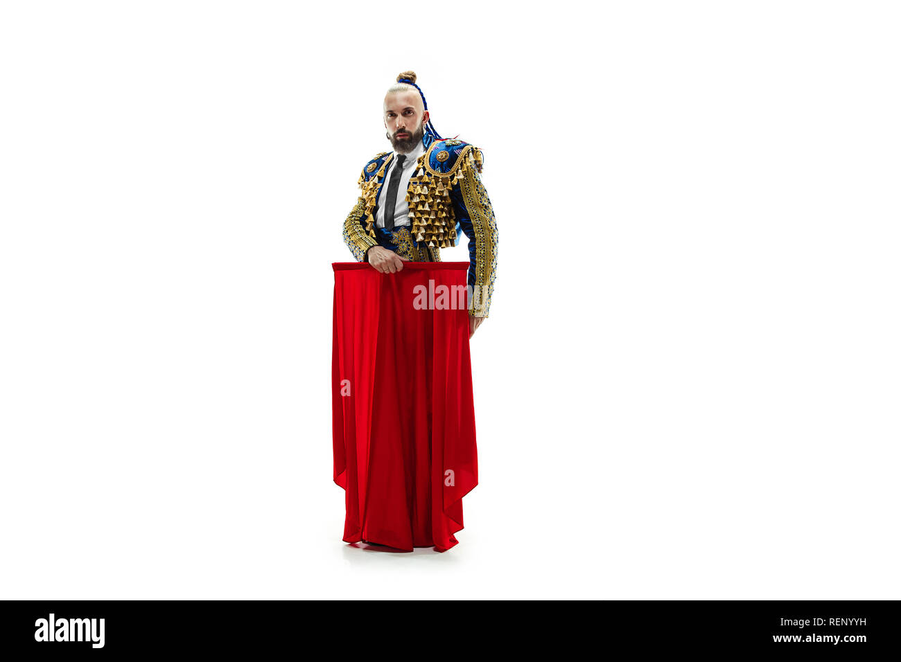 Torero en costume bleu et or ou torero espagnol typique isolated over white background studio. La mégère, l'atteinte de l'objectif, la mortification, conquête, patron, leadership, bataille, win, concept gagnant Banque D'Images