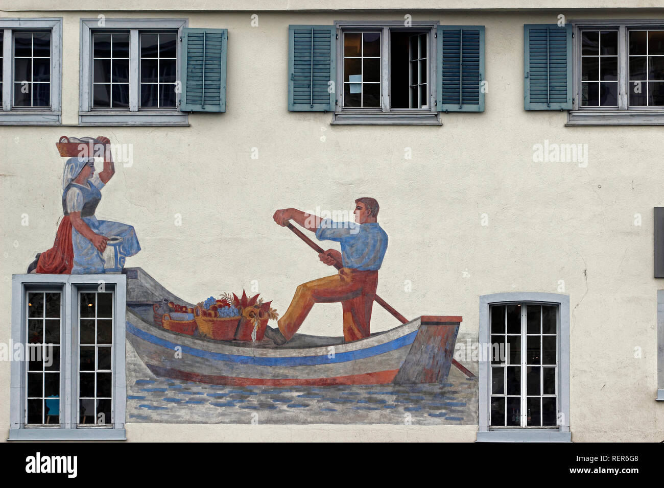 Le Canton de Zurich Suisse Zurich ville suisse sur la Limmat et Le Lac de façade murale peinte sur Schweizer Heimatwerk building le long de la rivière Banque D'Images