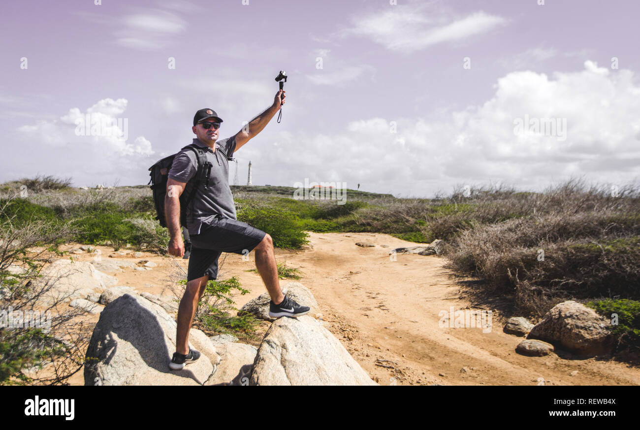 Jeune photographe Retour à la découverte de l'île de Aruba île heureuse Banque D'Images