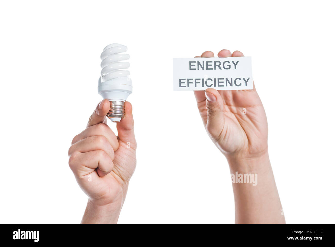 Portrait de male hands holding carte papier avec lettrage et lampe fluorescente isolé sur blanc, concept d'efficacité énergétique Banque D'Images