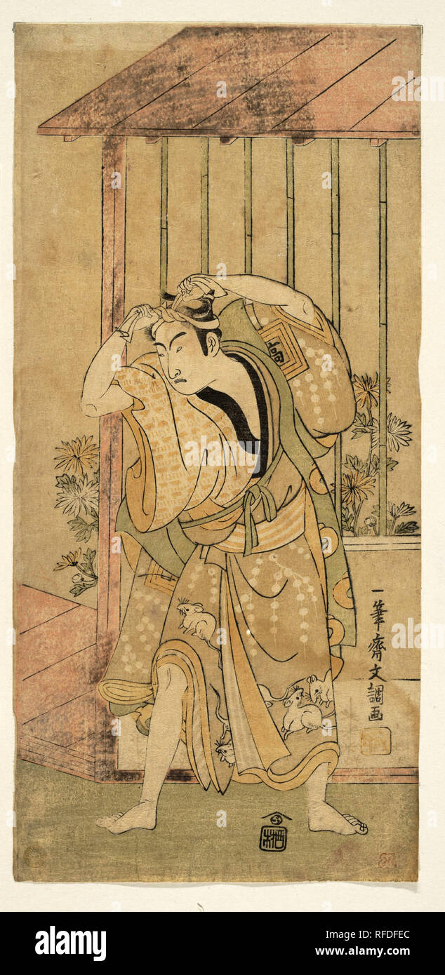 Ichikawa Komazo la première comme un homme debout à côté d'un bâtiment. Artiste : Ippitsusai Buncho (Japonais, actif 1760-1794). Culture : le Japon. Dimensions : 12 x 5 5/16 13/16 in. (31,3 x 14,8 cm). Date : 1770 ou 1771. Musée : Metropolitan Museum of Art, New York, USA. Banque D'Images