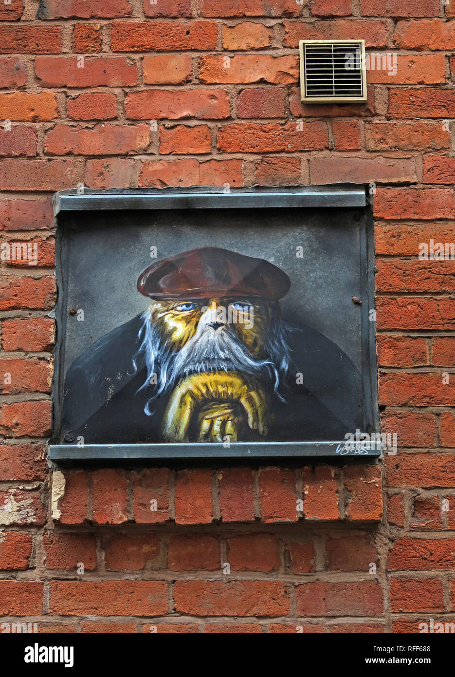 L'homme chien, dogface en casquette, Houldsworth Street, quart nord, Manchester, Angleterre, RU Banque D'Images