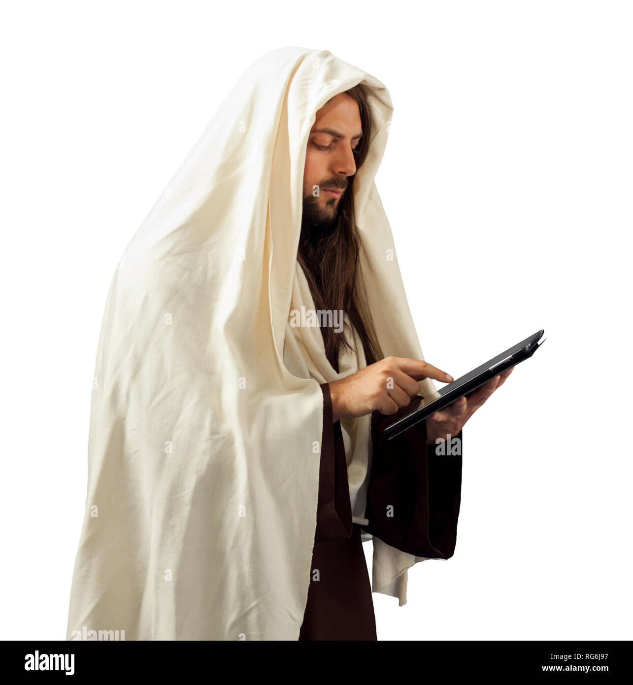 Jésus Christ se lit la Bible avec la tablette Banque D'Images