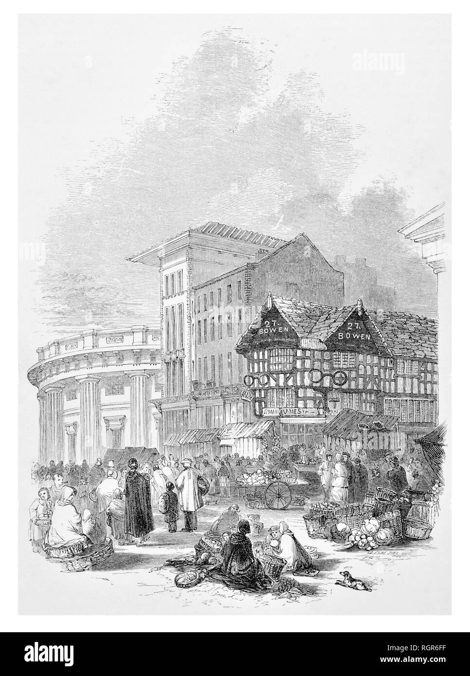 Marché, maisons anciennes et partie de l'échange de Manchester Banque D'Images