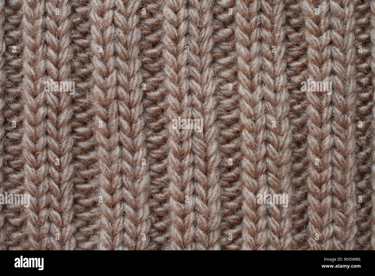 Tricots en laine marron clair la texture. Macro. Banque D'Images
