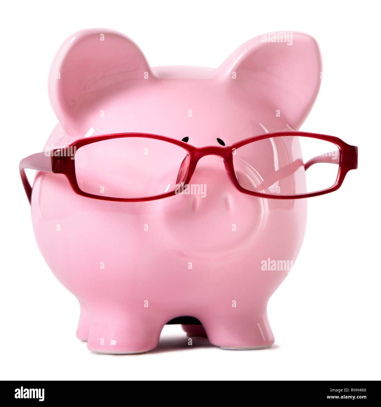 Pink piggy bank wearing glasses Banque D'Images