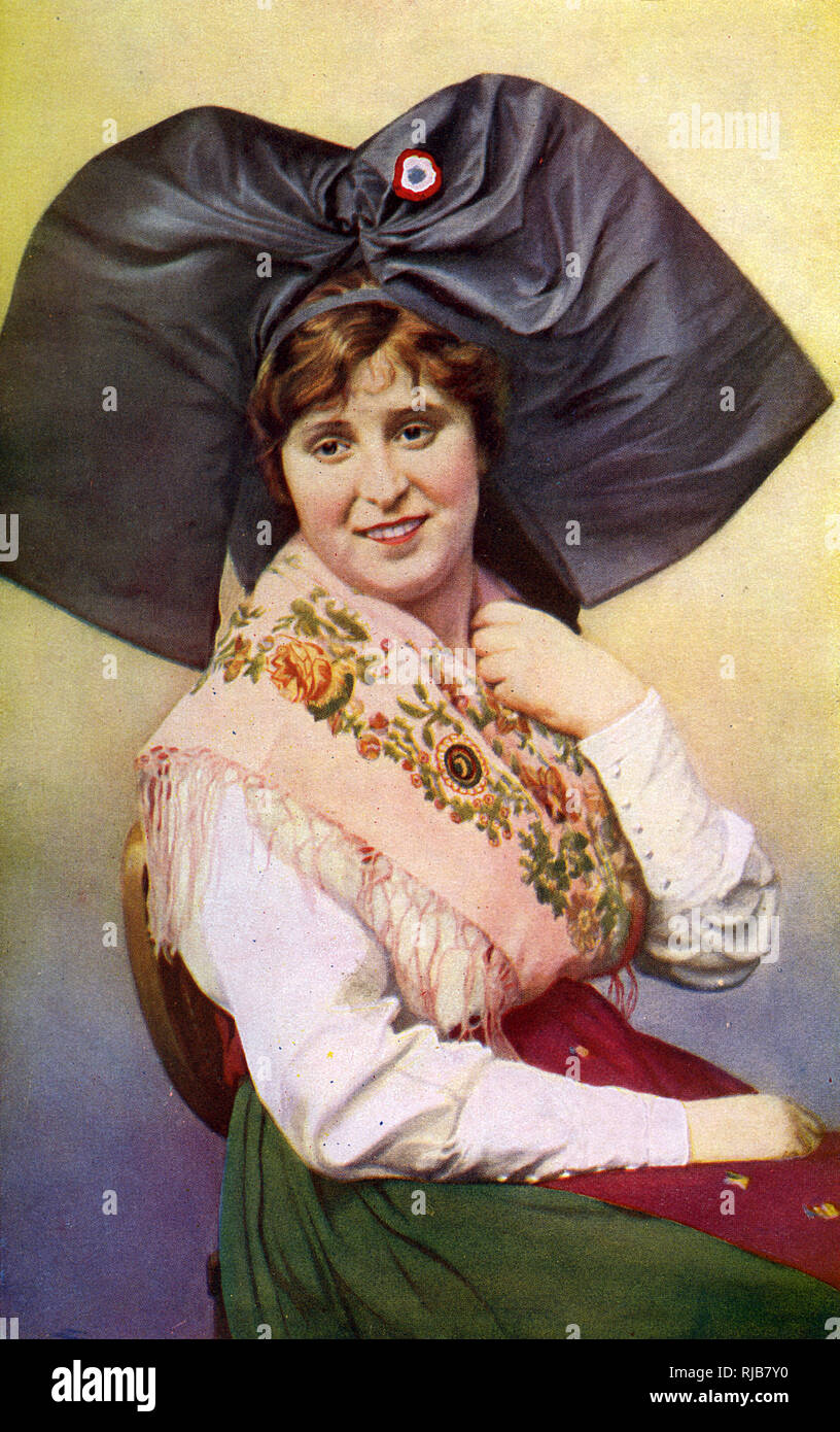 Jeune femme en costume traditionnel, Alsace, France Banque D'Images