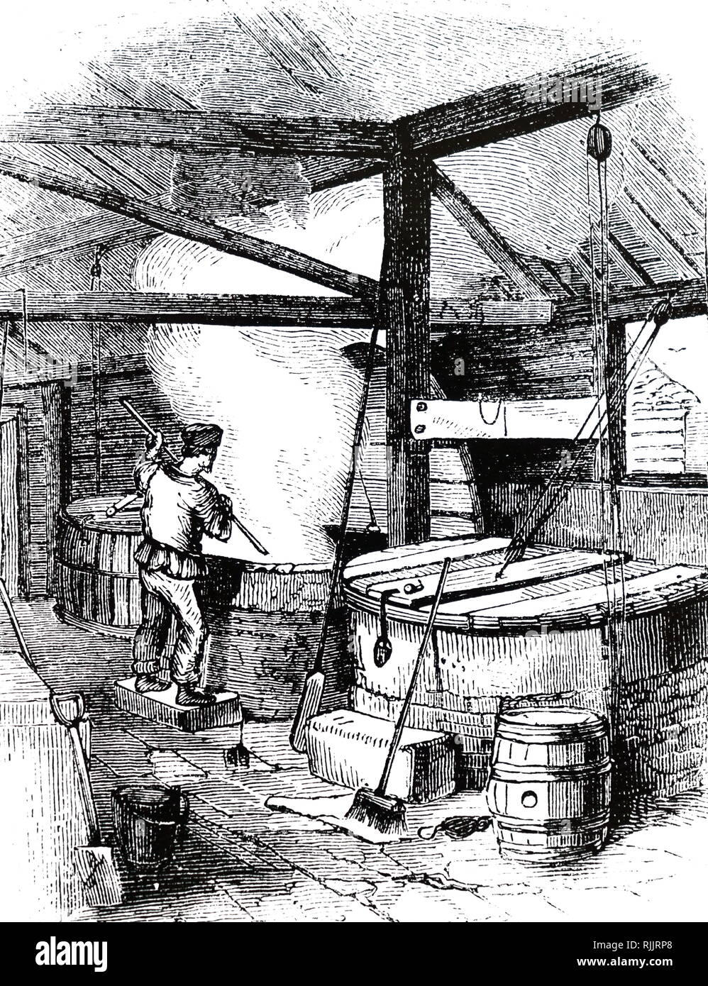 Une gravure illustrant le processus d'ébullition du savon. En date du 19e  siècle Photo Stock - Alamy