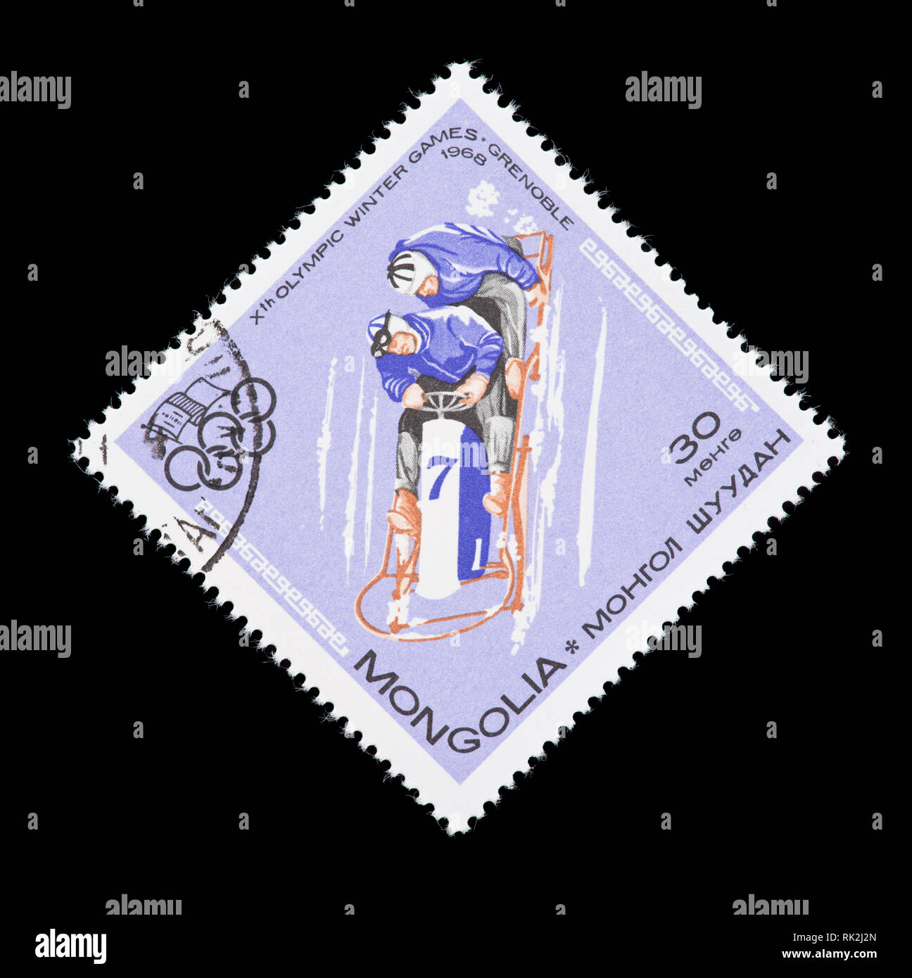 Timbre-poste de la Mongolie représentant un bobsleigh de quatre hommes, délivrés pour les Jeux olympiques de Grenoble 1968 Banque D'Images