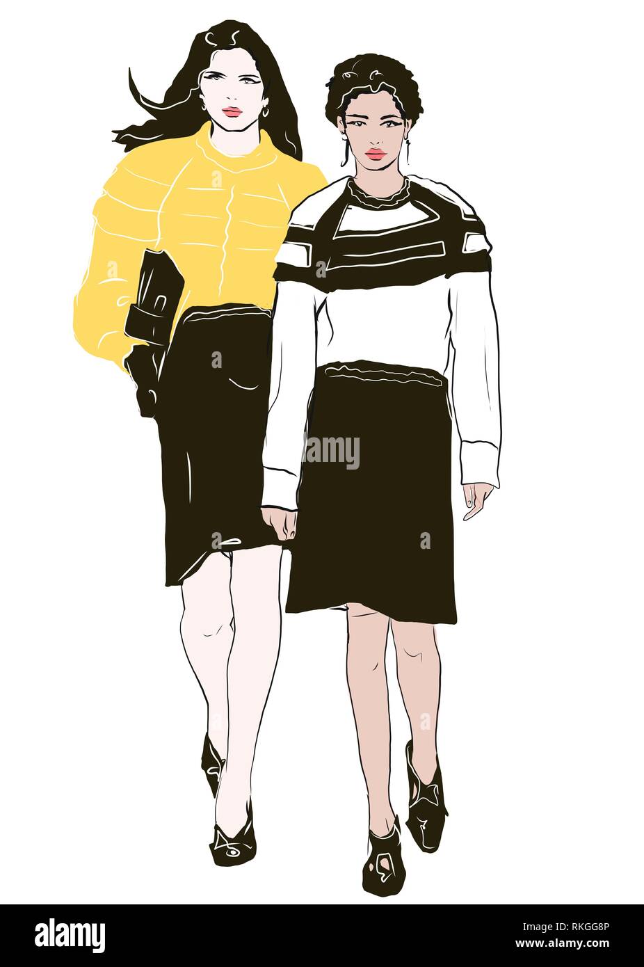 Deux filles de la mode dans les vêtements à la mode Banque D'Images