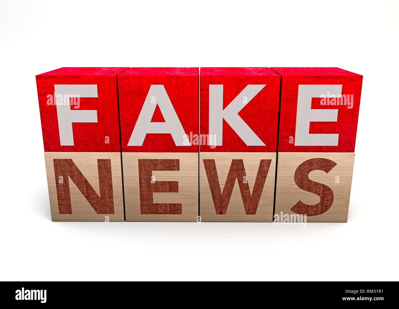 Bloc cube en bois sur fond blanc avec word fake news. Concept. Junk news désinformation délibérée ou canulars Banque D'Images