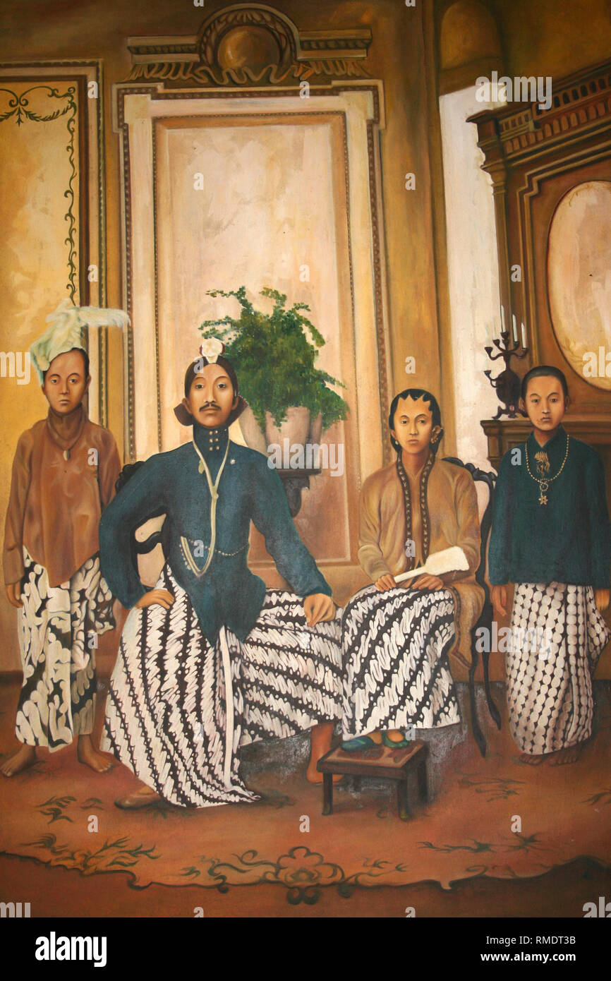 Tableau ancien montrant Family Group montrant des Hommes en costumes traditionnels javanais Beskap Banque D'Images