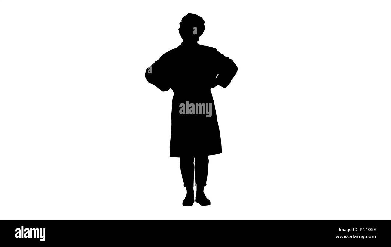 Silhouette femme médecin avec les mains sur les hanches, debout, détendu et souriant, très positif et joyeux. Banque D'Images
