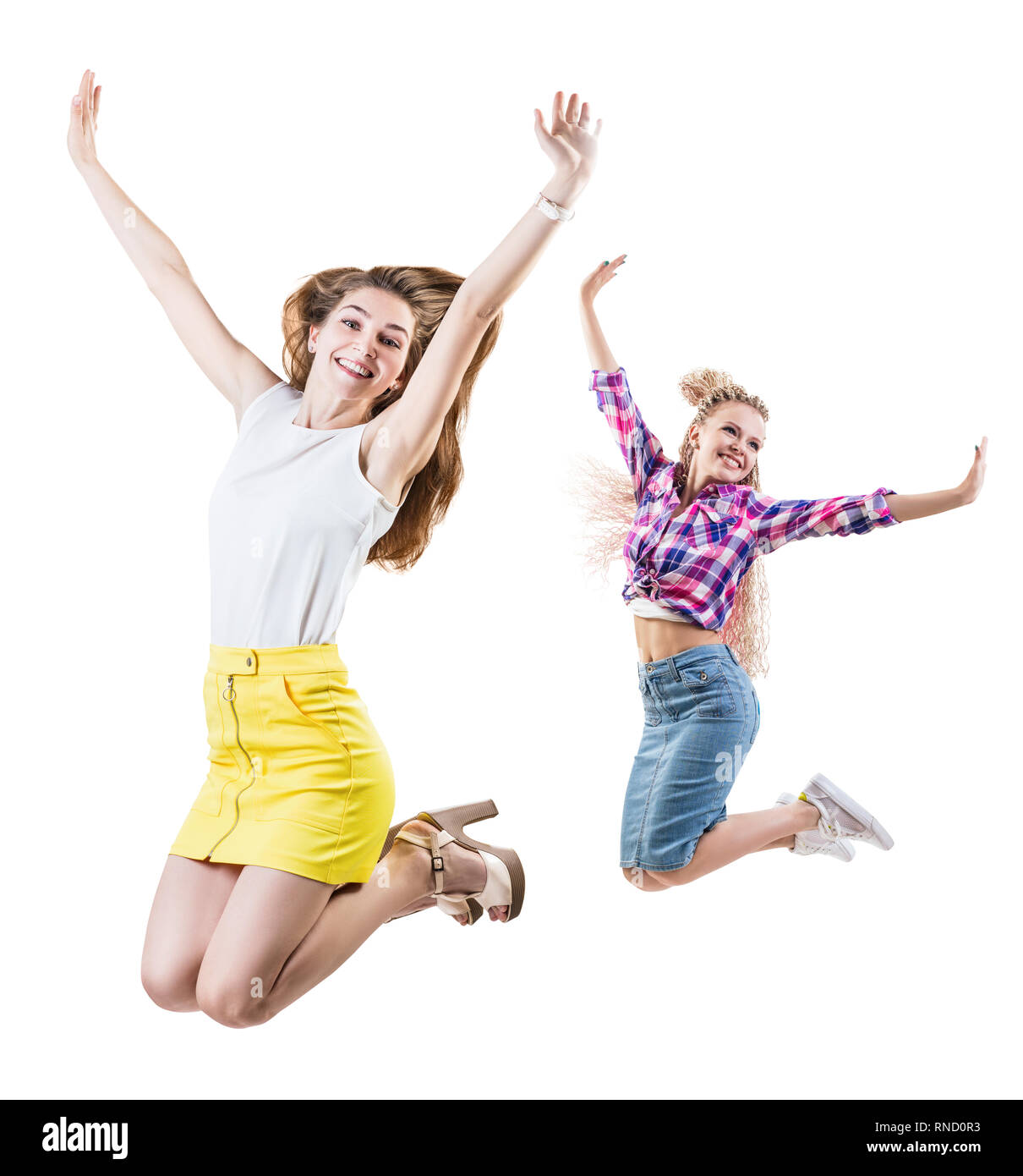 Collage de deux femmes saute à mains levées. Banque D'Images