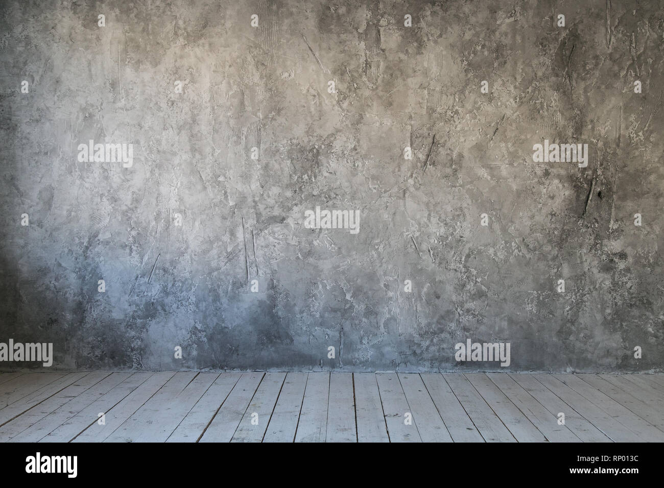 Mur texturé gris du béton et plancher de bois. Espace libre pour le texte Banque D'Images