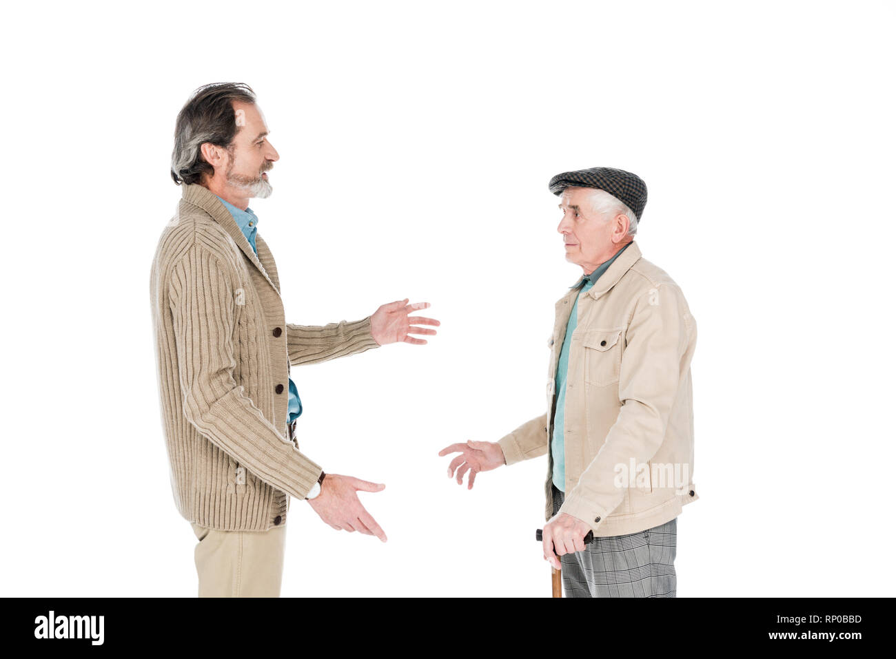Senior man talking avec ami avec canne isolated on white Banque D'Images