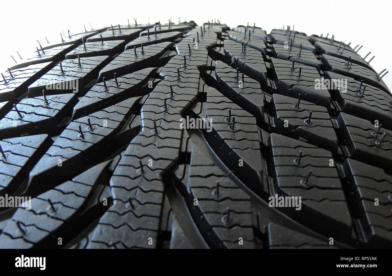 Point de contact du pneu sans crampons avec bande de roulement symétrique macro shot Banque D'Images