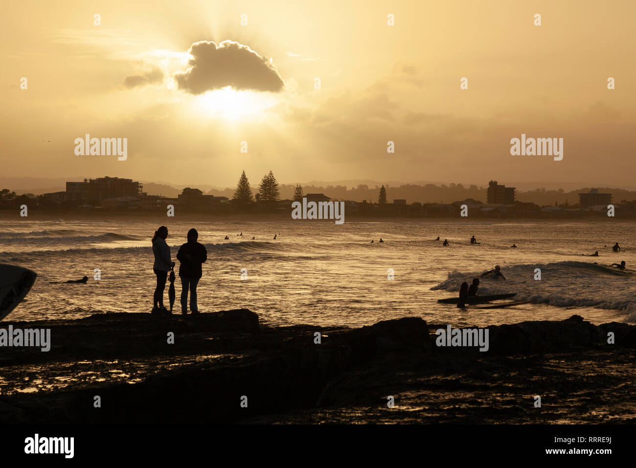 Silhouettes au coucher du soleil Banque D'Images