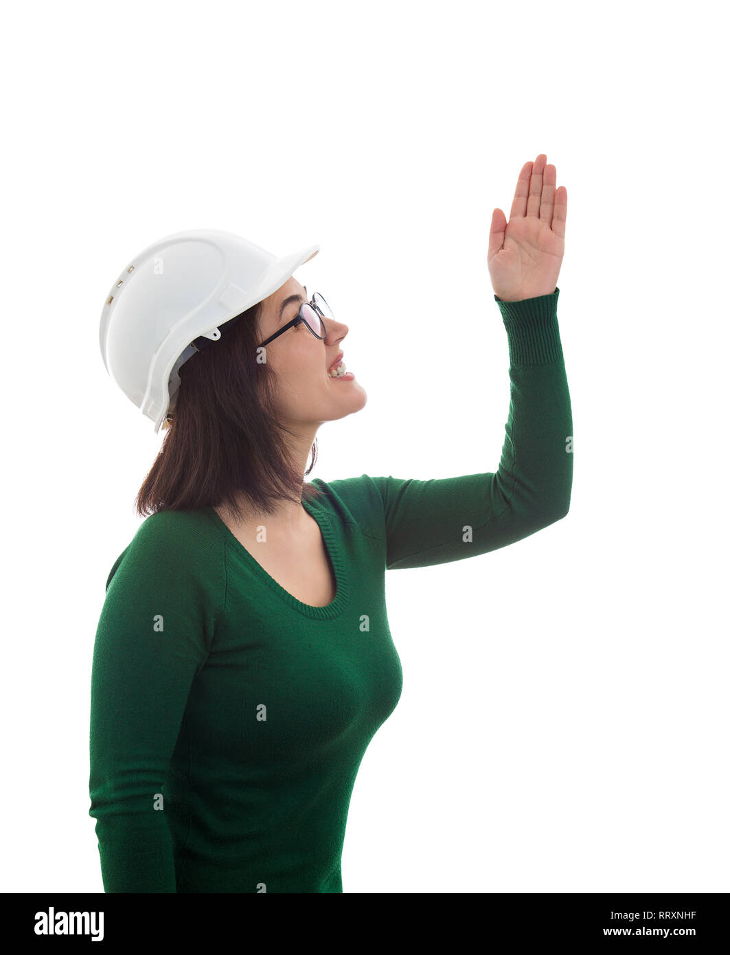 Vue latérale d'ingénieur angry woman raising hand up et réprimandes quelqu'un. L'émotion négative isolated over white. Expliquer les travaux manager frustré Banque D'Images