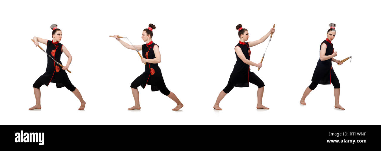 Femme drôle avec nunchucks isolated on white Banque D'Images