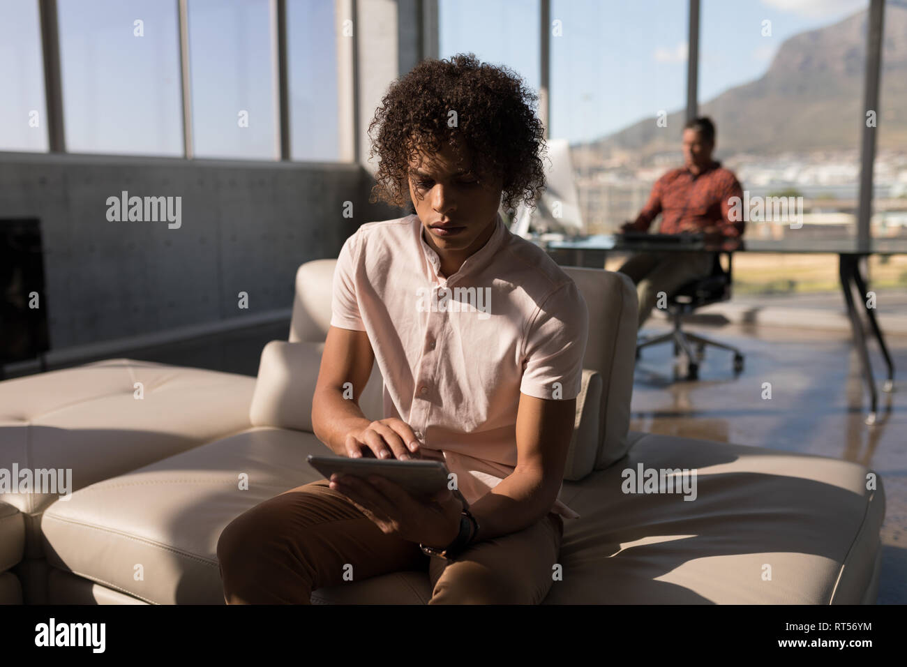 Male executive using digital tablet in office Banque D'Images