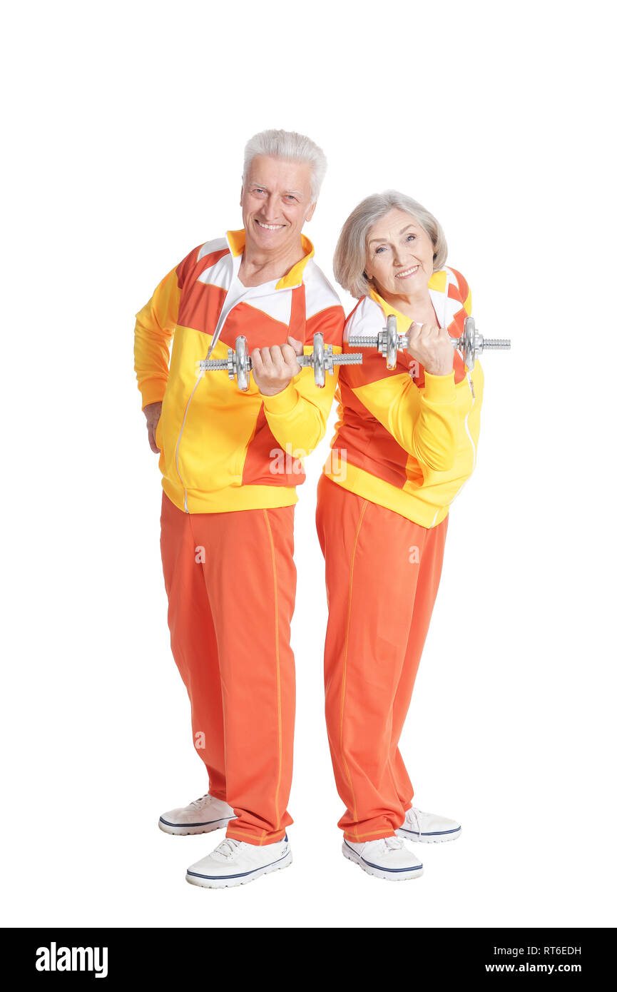 Happy senior couple actif exerçant sur blanc Banque D'Images