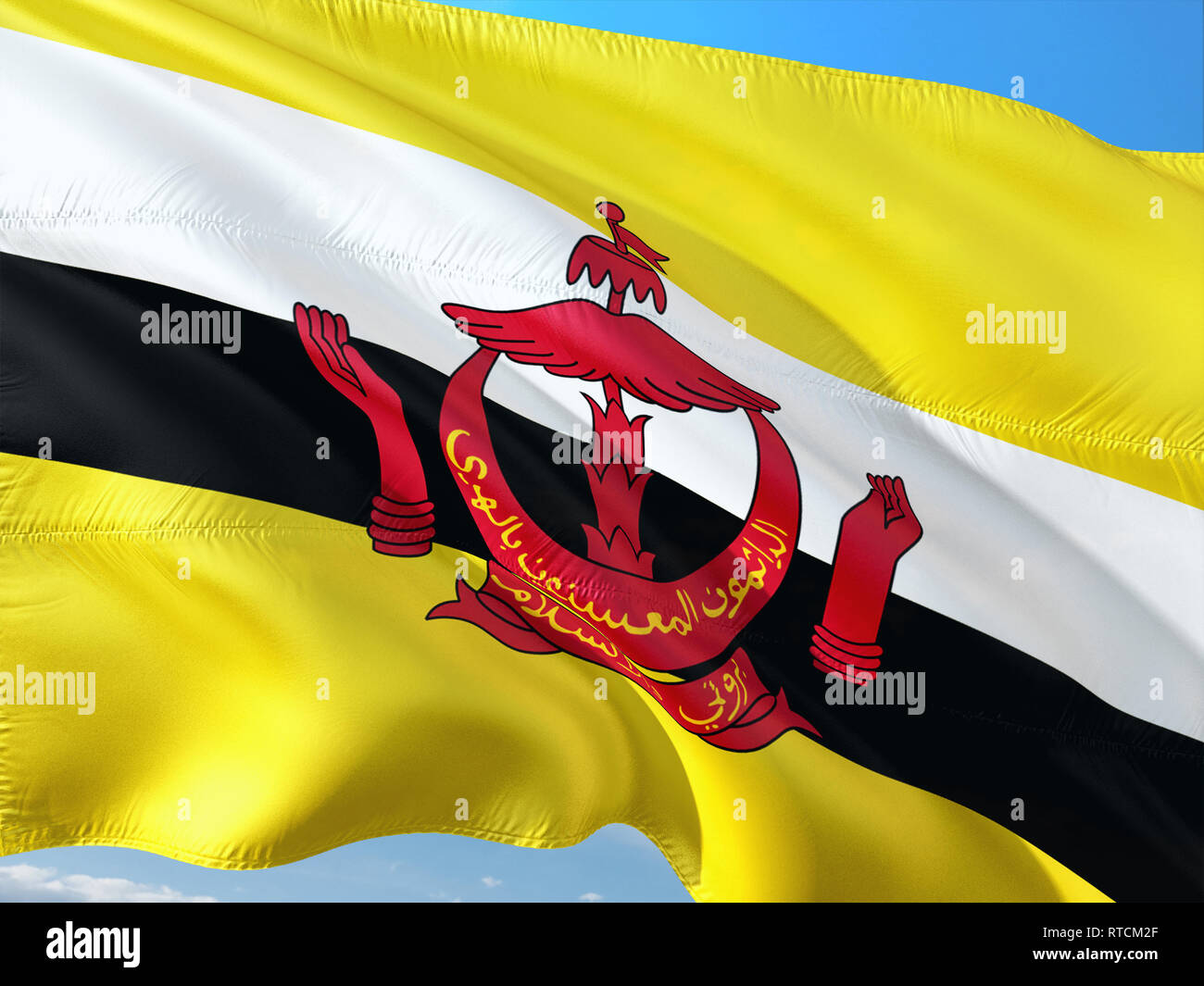 Pavillon de Brunei forme dans le vent contre ciel bleu profond. Tissu de haute qualité. Banque D'Images