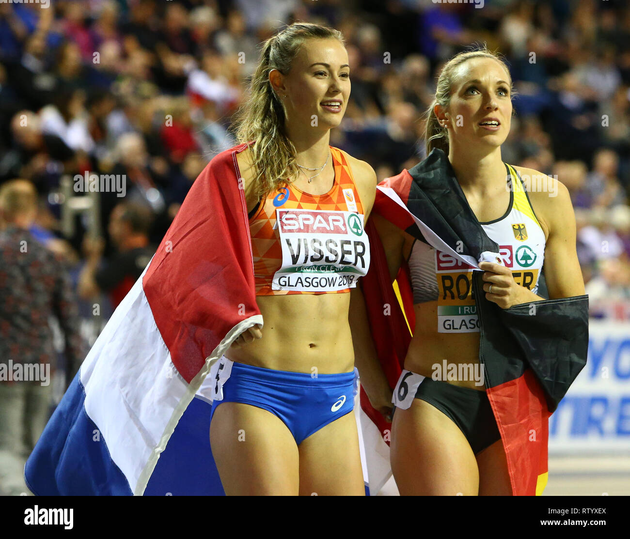 Unis Arena, Glasgow, Royaume-Uni. 3e Mar, 2019. European Athletics Indoor Championships, jour 3 ; Nadine Visser (NED) et Cindy Roleder (GER) célébrer après avoir remporté l'or et l'argent au cours du 60m haies femmes crédit final : Action Plus Sport/Alamy Live News Banque D'Images