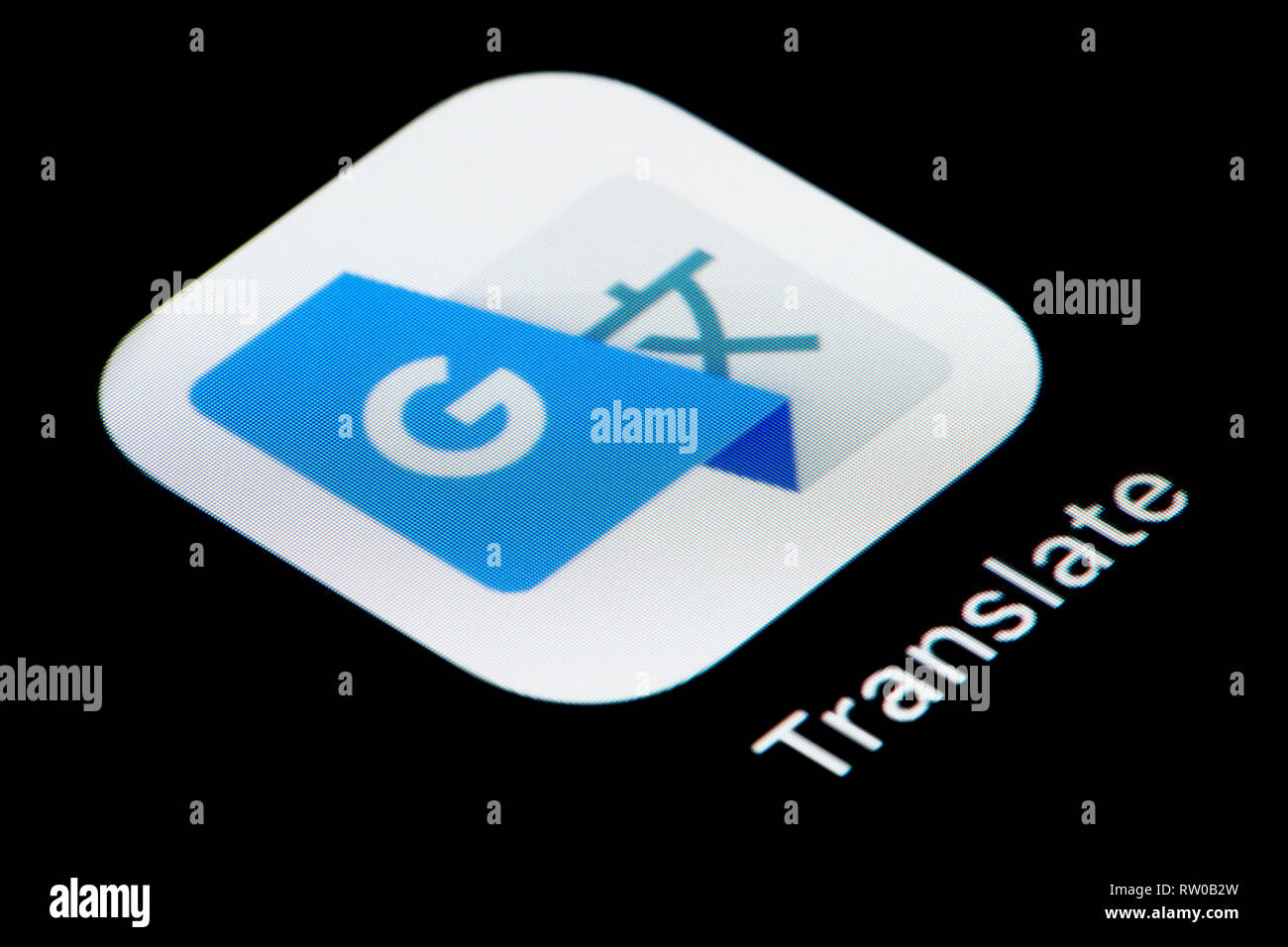 Un gros plan de l'icône de l'application Google Translate, comme on le voit sur l'écran d'un téléphone intelligent (usage éditorial uniquement) Banque D'Images