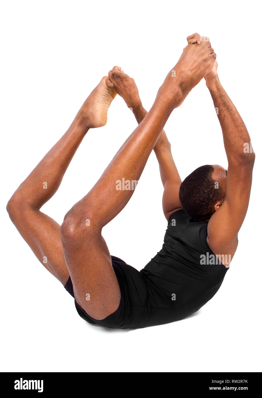 Male ballet dancer le réchauffage et faire preuve de souplesse à fond blanc Banque D'Images
