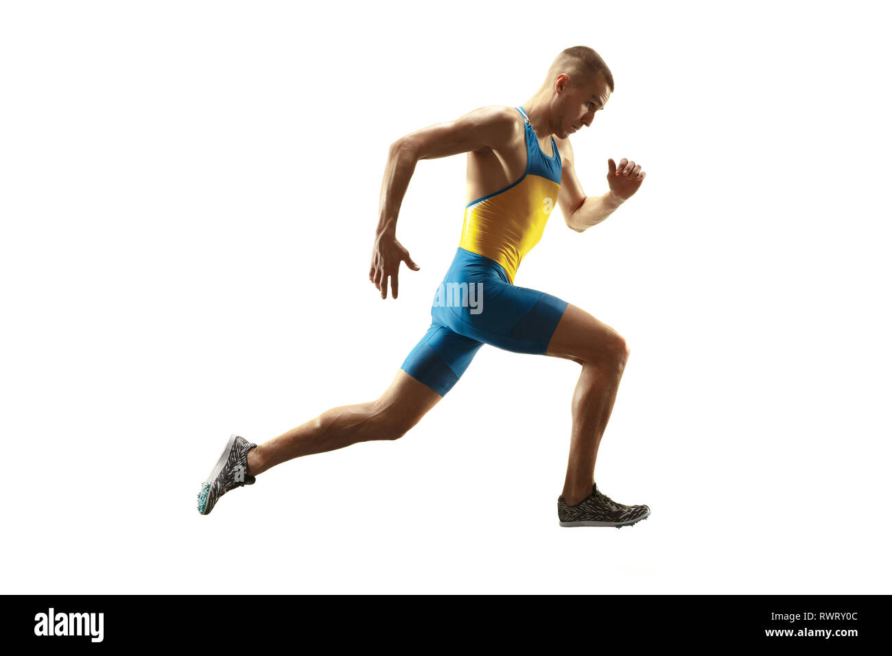 Young caucasian man running isolated on white background studio. Un mâle runner ou du jogging. Silhouette d'athlète de jogging avec les ombres. Banque D'Images