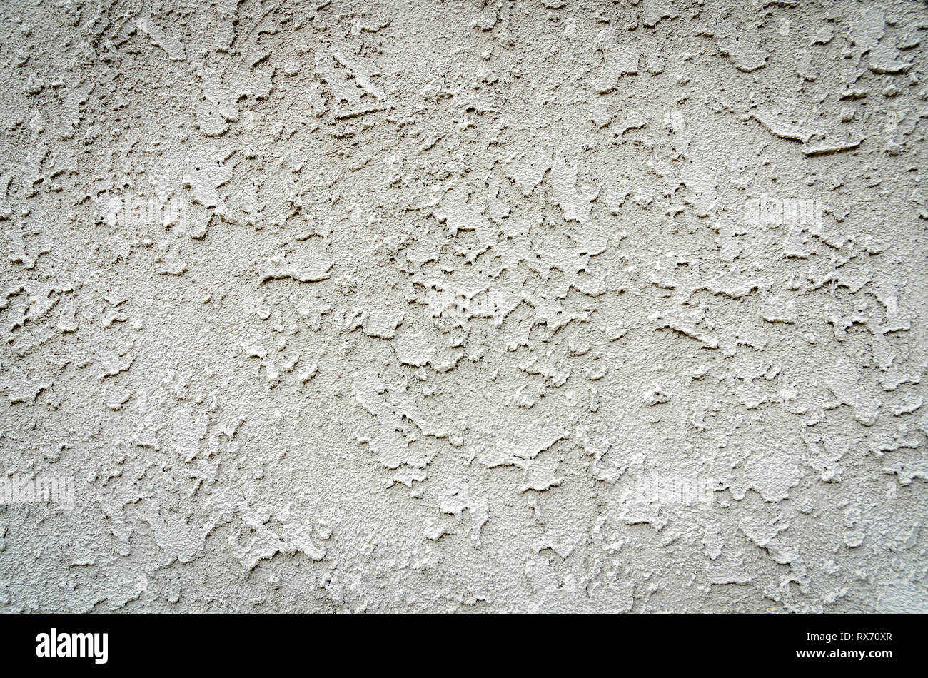 Close-up d'un mur en stuc blanc sale. Banque D'Images