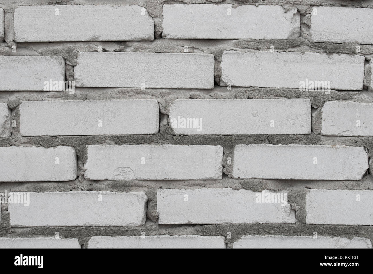 Old weathered gray brick wall texture background Banque D'Images