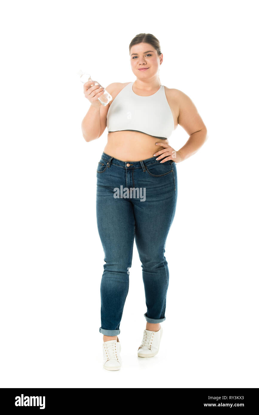 Smiling woman holding jeans en excès d'eau l'isolated on white Banque D'Images
