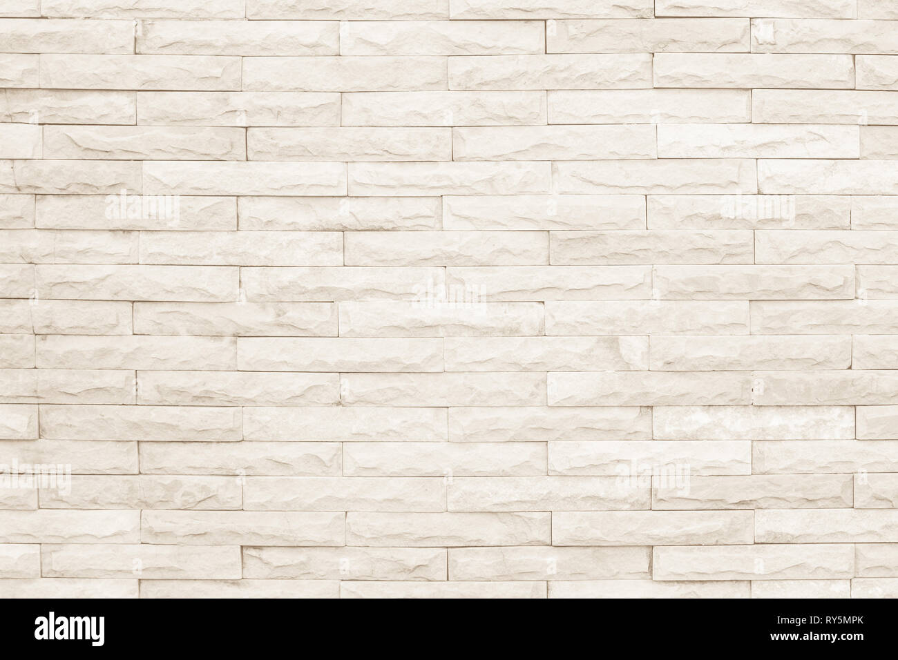 Crème et blanc mur texture background. La maçonnerie en pierre ou parquet ancien modèle rock intérieur béton clair profil briques inégales stac design Banque D'Images