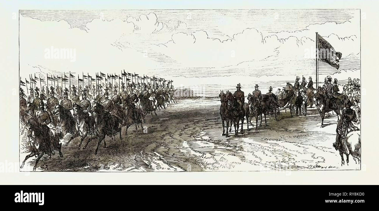 Visite du Prince et de la princesse de Galles à l'Irlande : examen dans le Parc Phoenix : Le 12e Lanciers 1868 passé au galop Banque D'Images