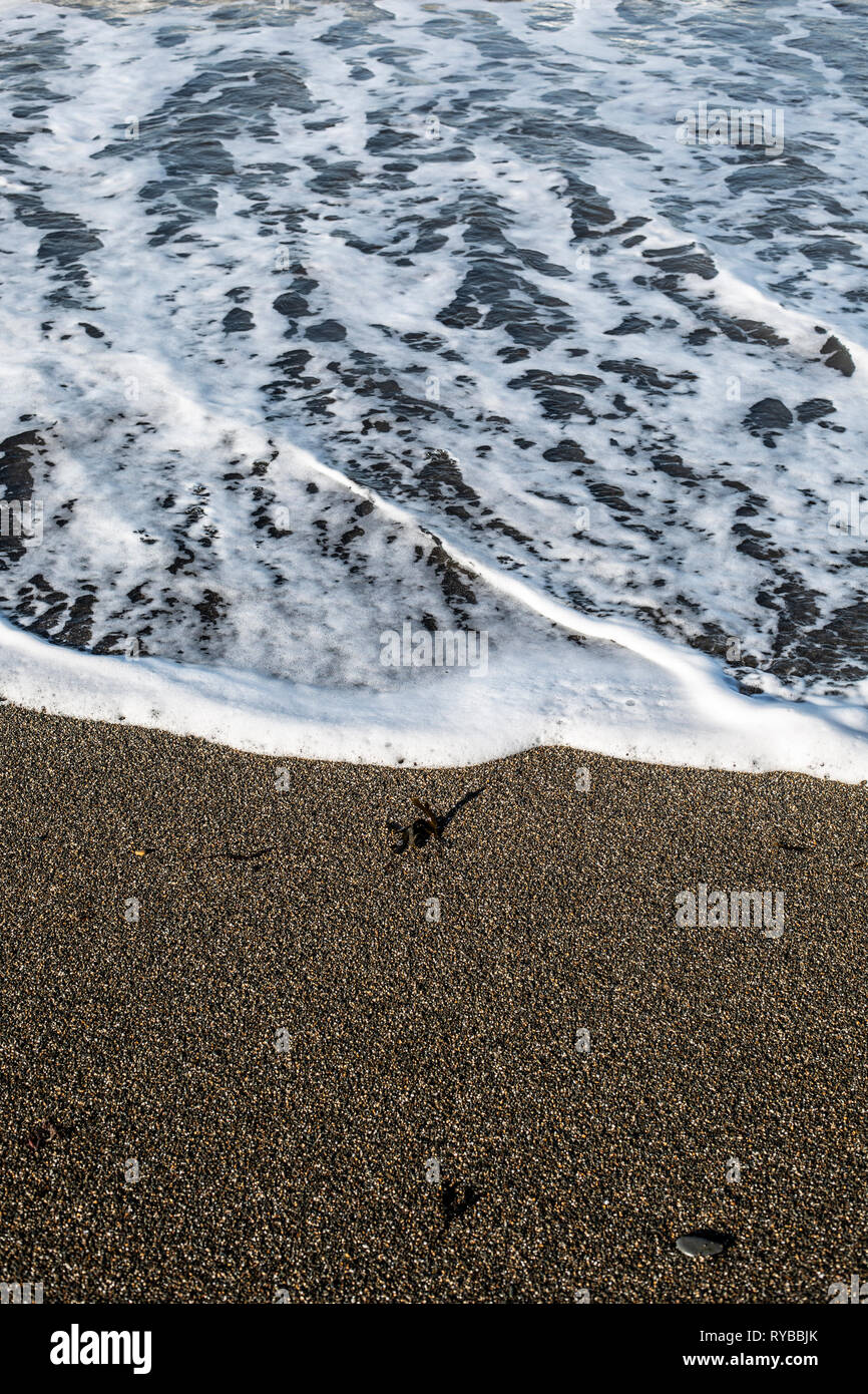 Marée sur la plage d'Aberystwyth. Banque D'Images