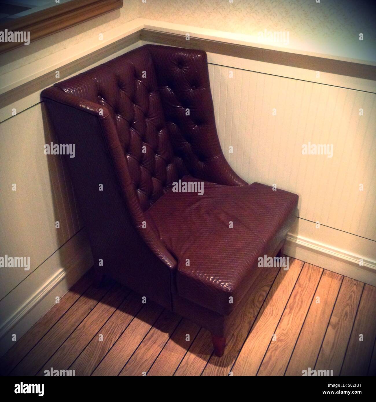 Chaise en cuir à corner Banque D'Images