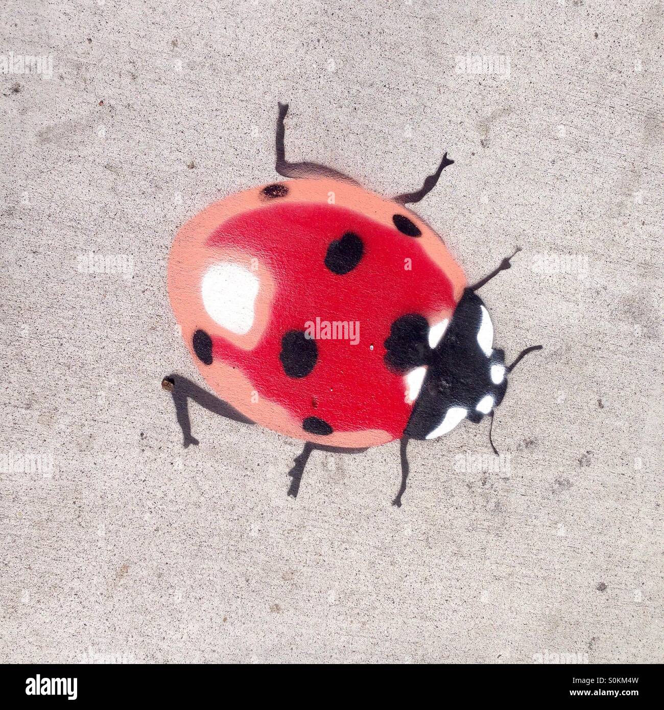 Lady Bird lady bug street art stencil art Banque D'Images