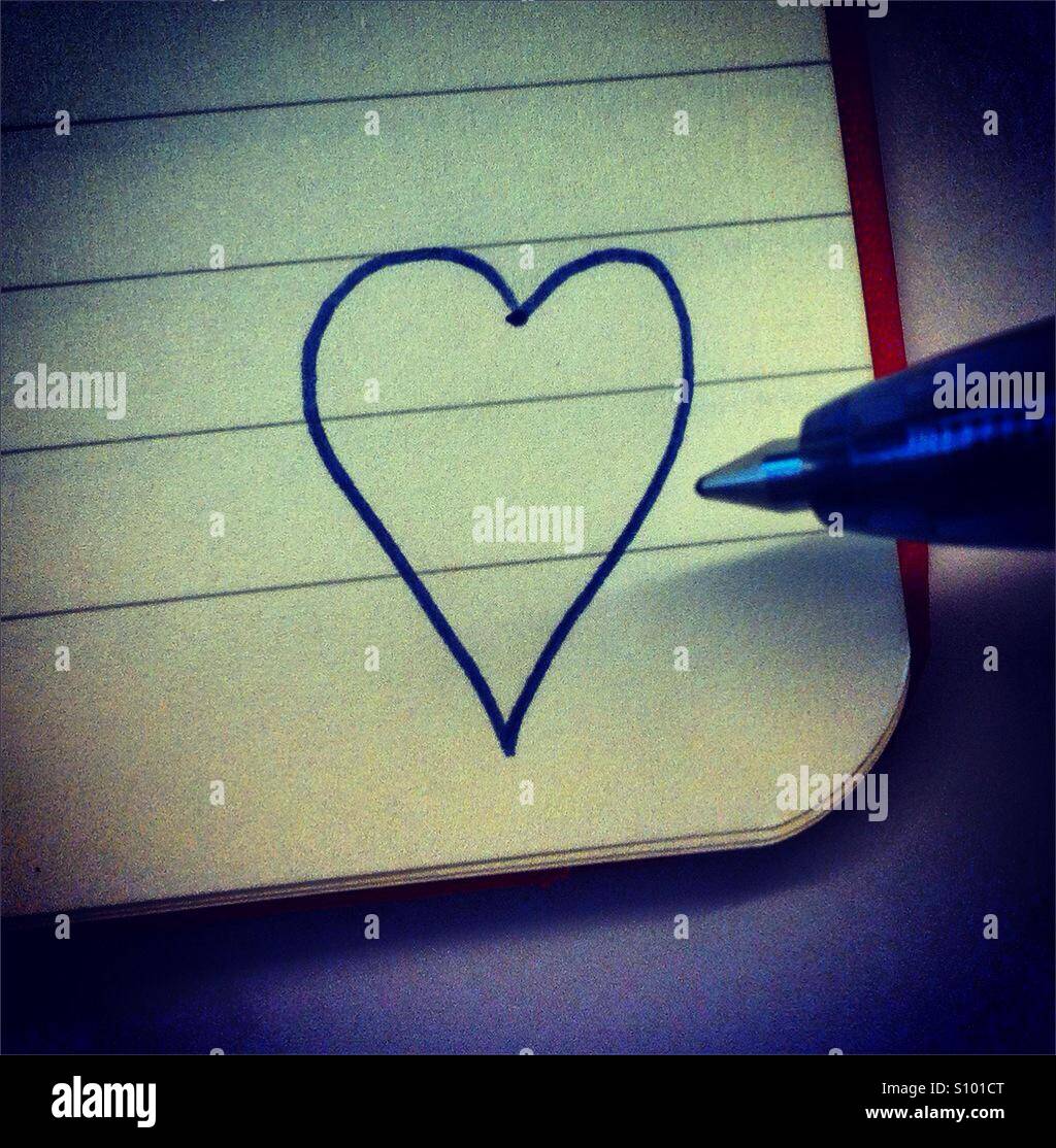 L'icône de l'amour tiré sur une booknote - Image de stock capturée avec un smartphone