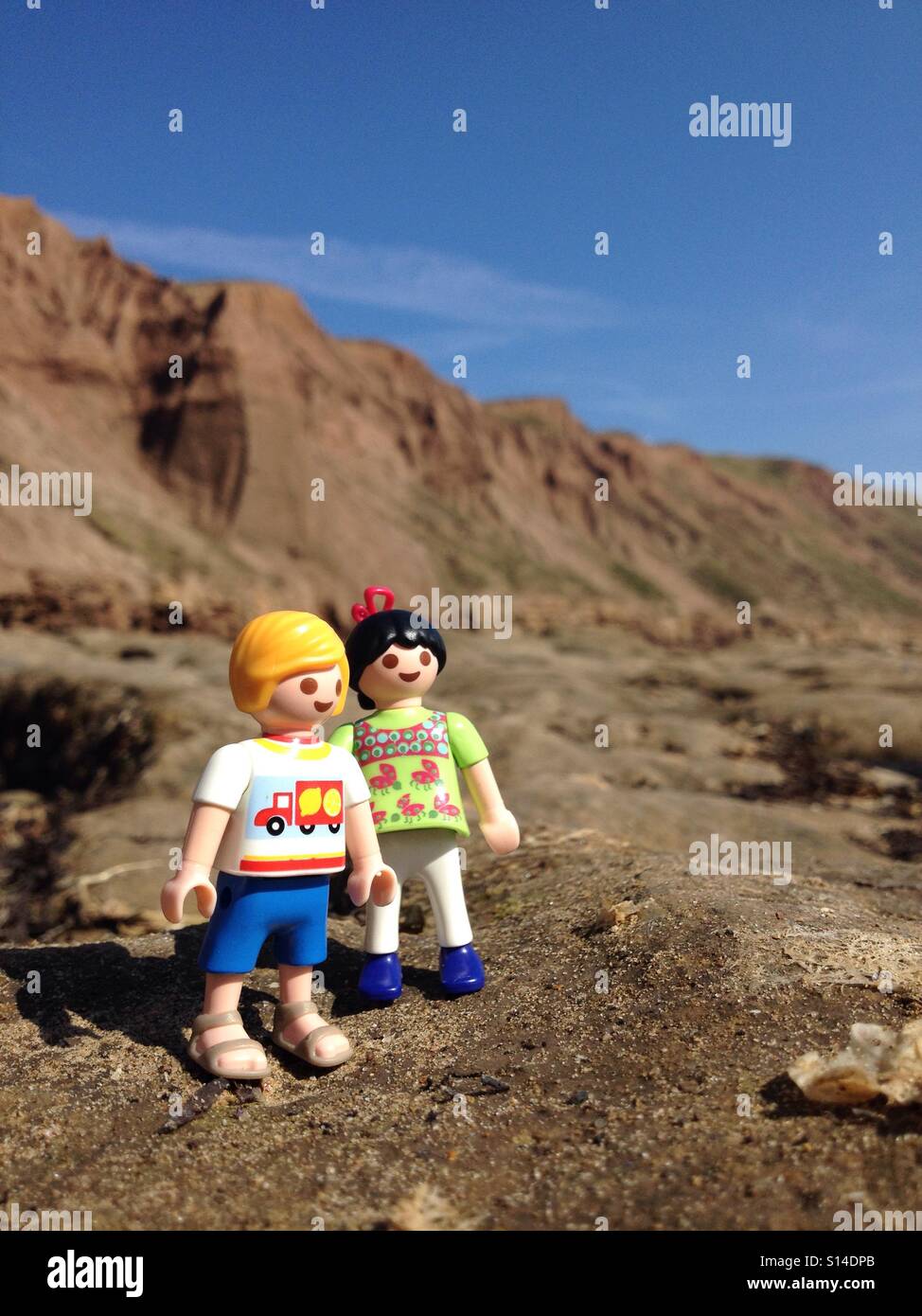 Playmobil figures on rocks Banque D'Images