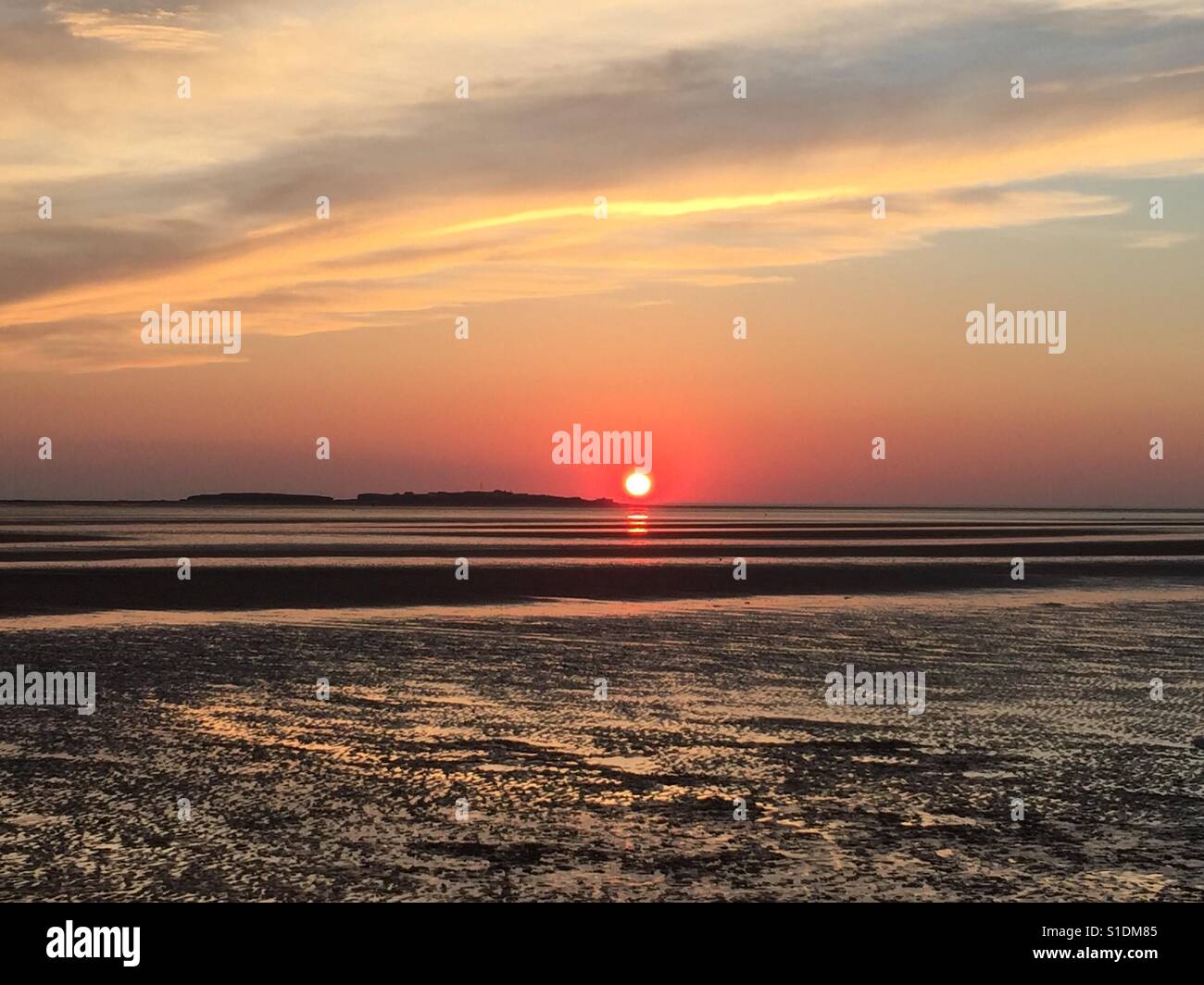 Coucher de soleil sur Hilbre Island, West Kirby Banque D'Images