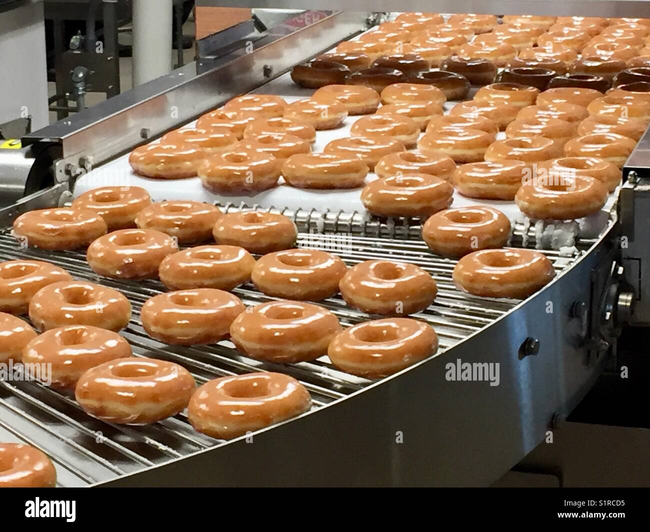 Krispy Kreme tapis roulant Banque D'Images
