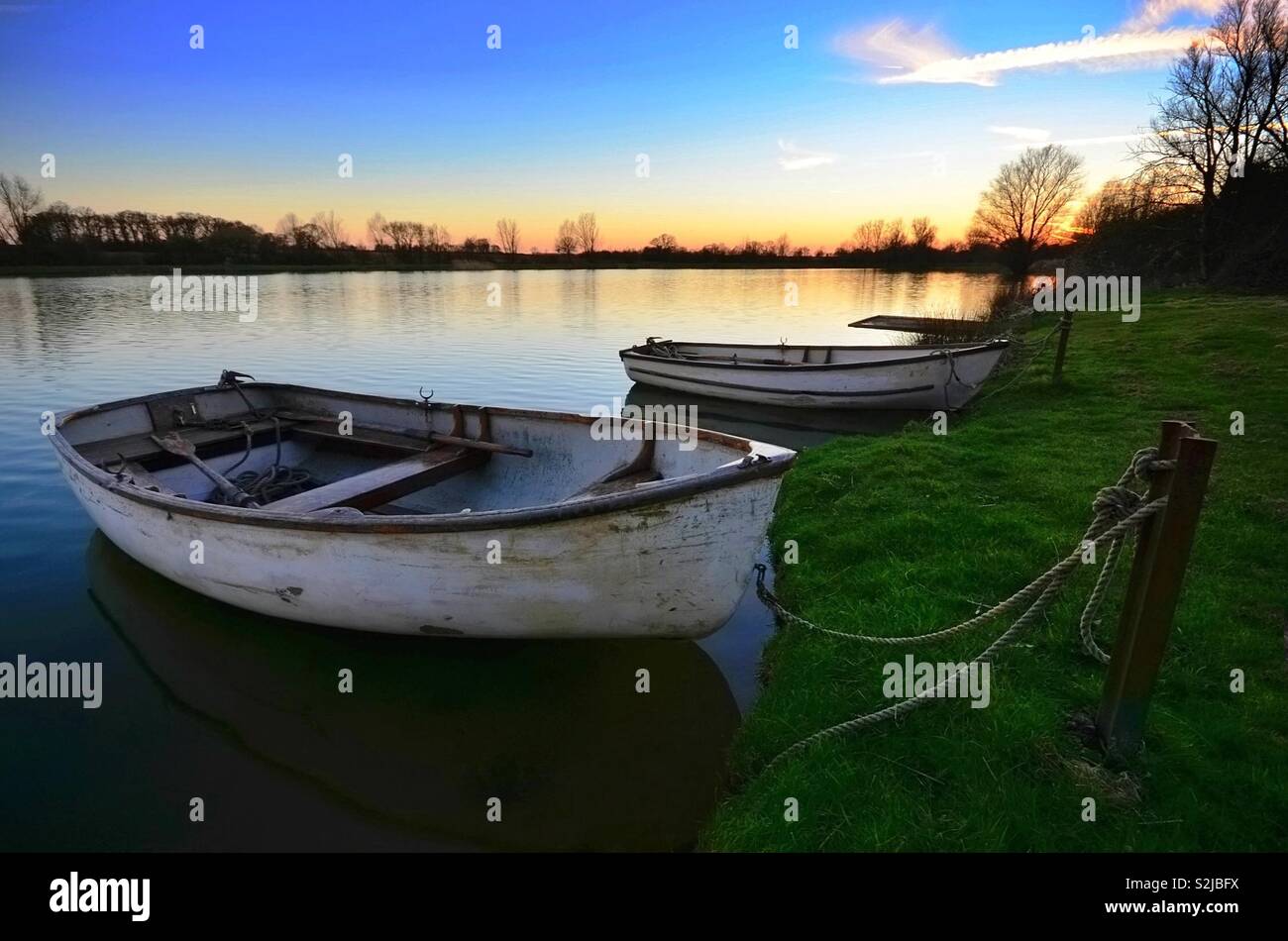 Bateaux au coucher du soleil Banque D'Images