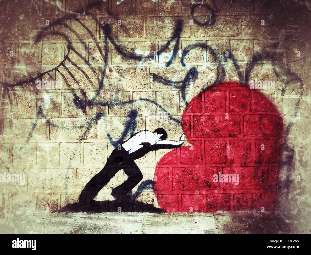 Graffitis de style Banksy peints sur le mur de la rue à Brighton, au Royaume-Uni Banque D'Images