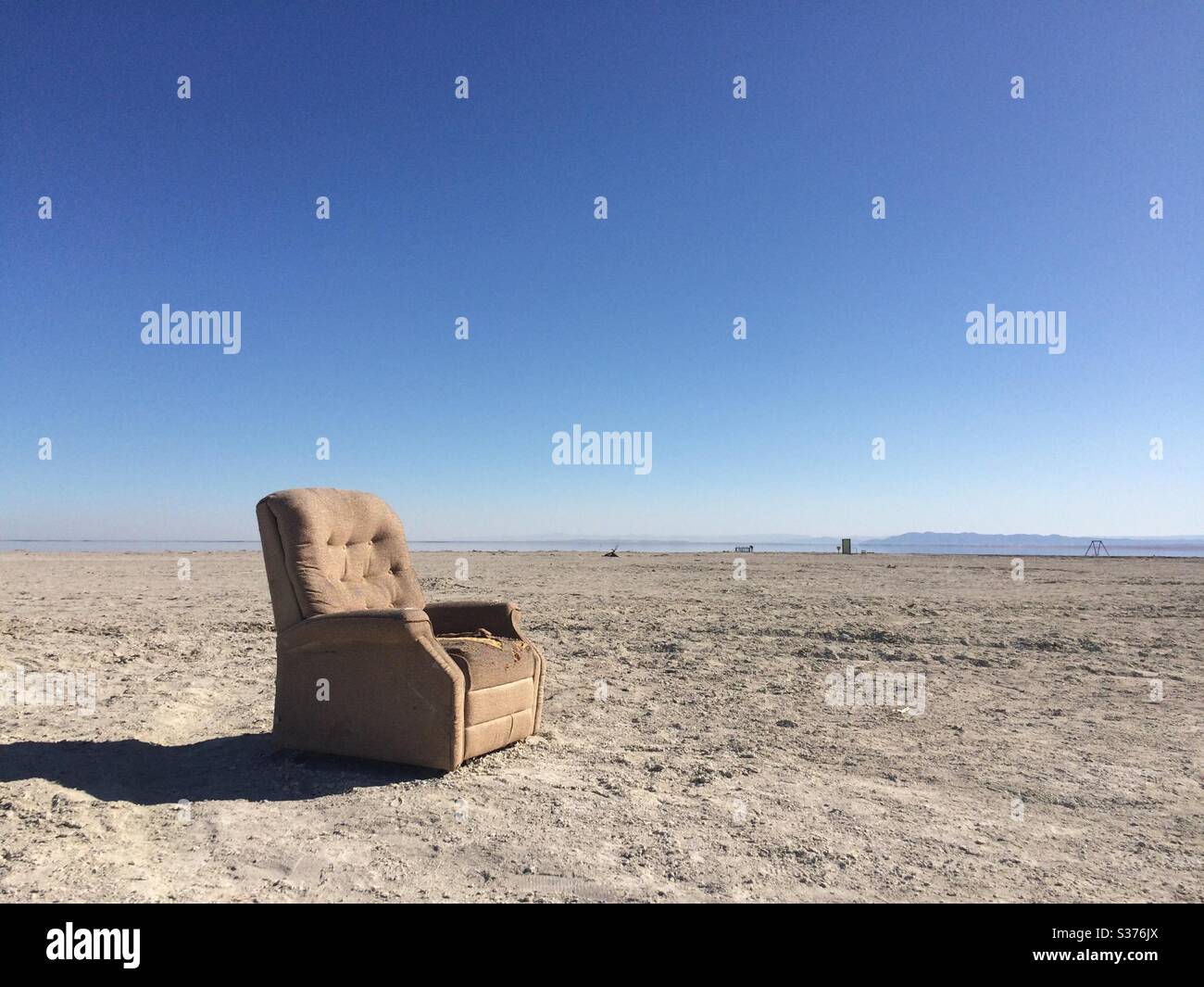 Fauteuil seul sur la plage Banque D'Images