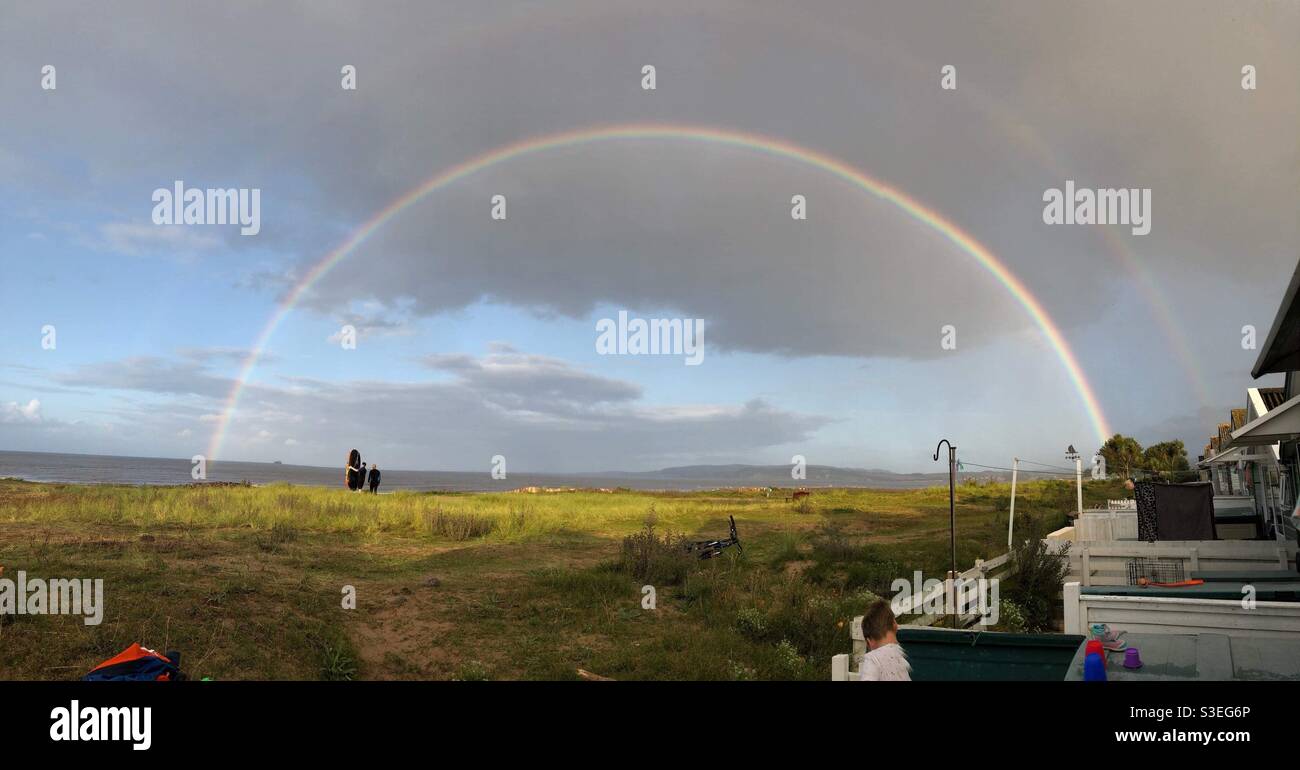 Rainbow sur dunster Beach Banque D'Images