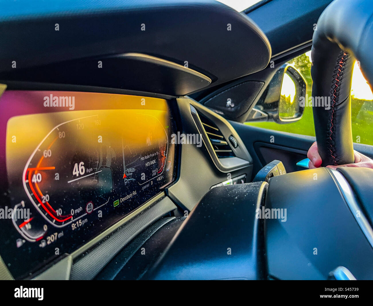 Une BMW 128ti en voiture pendant le coucher du soleil Banque D'Images