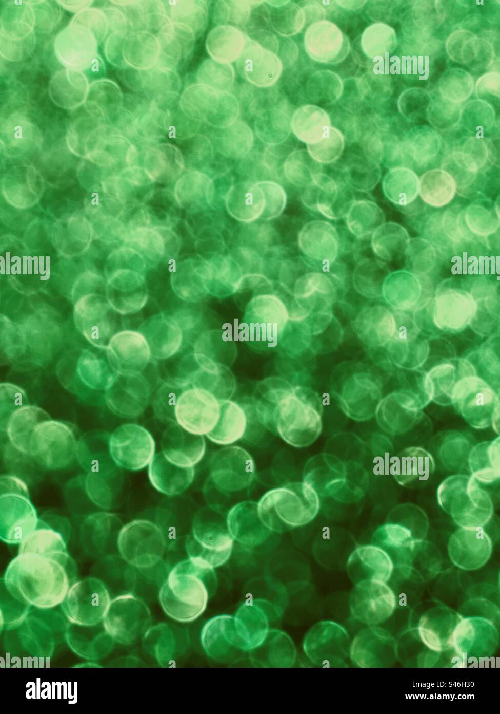Fond vertical vert de bokeh de paillettes Banque D'Images